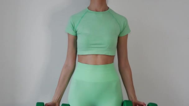 Slim Young Athletic Woman Lifts Dumbbells Green Tracksuit Leggings Top — Vídeos de Stock