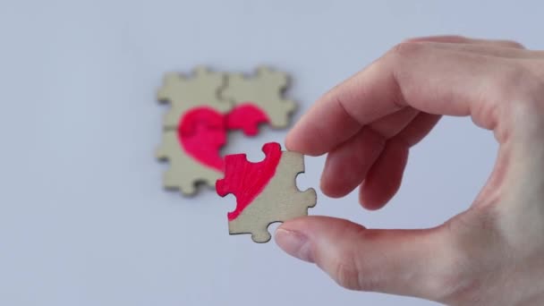 Mending Broken Heart Womans Hand Assembles Small Puzzle Wooden Puzzle — ストック動画