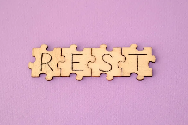 Learning Rest Hand Lettering Wooden Puzzles Purple Background — Stock Photo, Image