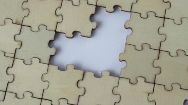 Missing heart-shaped puzzles. A background of puzzles with a white empty space