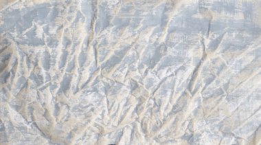 Beige old crumpled paper with gray crumples.