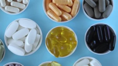 Many different popular supplements on a blue background. Maintaining health and beauty. healthy diet.