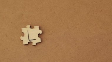 Written word abbreviation lchf Low Carb High Fat on wooden puzzles. Woman putting a puzzle together.