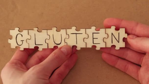 Woman Assembles Word Out Wooden Puzzles Say Gluten Written Word — Vídeos de Stock