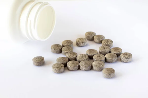 Brown Tablets Spots White Background Scattered Jar Iron Supplements Health — Foto de Stock