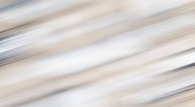 Bulanık bir hareketle bej, beyaz ve siyah gradyan. Kartpostal, metin için boşluk.