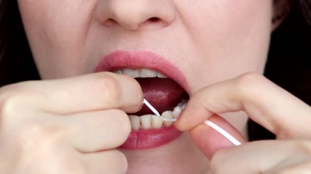Woman Brushing Her Teeth Dental Tape Close — Stock Video