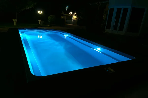 Blue pool at night. Night swimming on site.