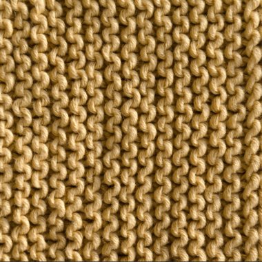 Bej jartiyer deseni pamuk ipliğiyle örülmüş. El yapımı konsept, hobi, moda online örgü kursu.