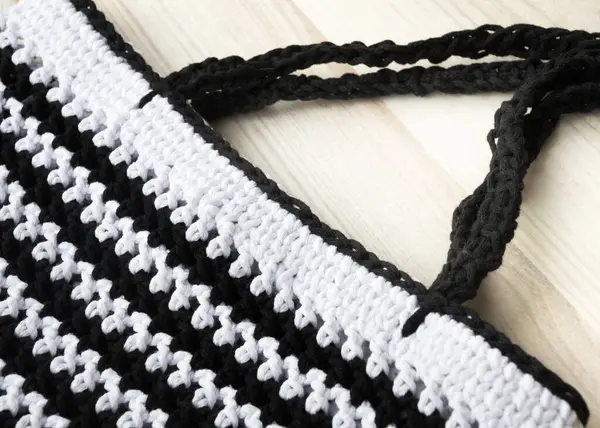 Cotton yarn. Cotton cord pattern in black and white. A fragment of a women\'s handbag made from ECO yarn.