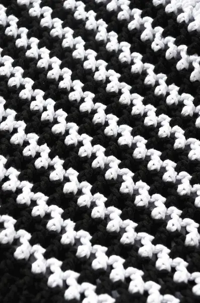 Cotton yarn. Cotton cord pattern in black and white. A fragment of a women\'s handbag made from ECO yarn.
