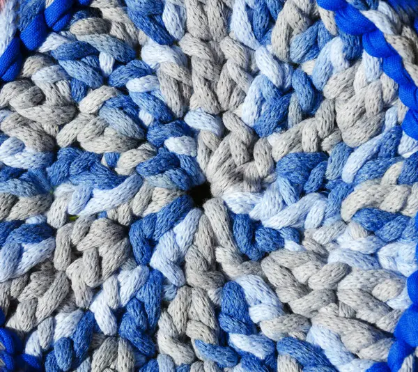 Cotton yarn. Cotton cord pattern in blue and light blue. A fragment of a women\'s handbag made from ECO yarn.