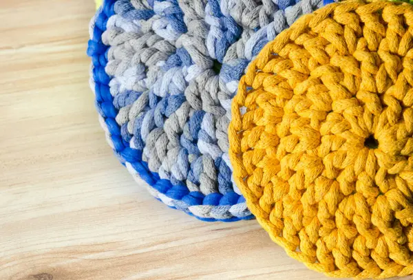 Cotton yarn. Blue and yellow cotton cord pattern. A fragment of a women\'s handbag made from ECO yarn.