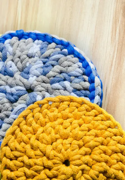 Cotton yarn. Blue and yellow cotton cord pattern. A fragment of a women\'s handbag made from ECO yarn.