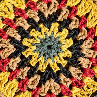 Raffia yarn texture. Granny square made of raffia in multicolored flowers. Eco-friendly material for handcraft. clipart