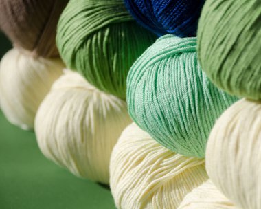 Yarn rolls close-up. Fashionable and colorful colors. Soft cotton yarn ready for knitting. clipart