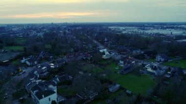 High angle aerial panorama view over residential area. Streets with detached houses large gardens. Cityscape, shopping center and industrial area and high office buildings in the city of Nijmegen in the Netherlands