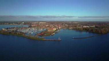Dolly shot historical harbor city in Hoorn Noord-Holland the Netherlands. Cityscape Aerial view Morning in Winter.