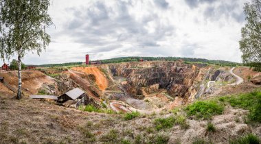 Discover the vast landscape of Great Copper Mountain, local tourist attraction in Falun Sweden. This historic site showcases the remnants of copper mining within the Great Pit, panoramic view