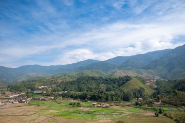 Natural background of the mountain view with blue sky and rice fields in rural. Nan province, The north of Thailand.