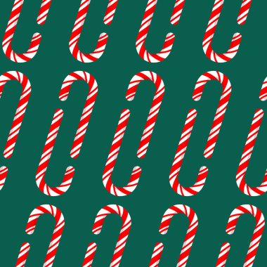 Yeşil arka planda istiflenmiş noel şeker kamışlarının kusursuz deseni