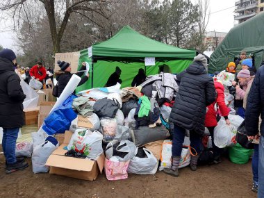 Humanitarian aid in Ukraine. Volunteers collect clothes and food for victims of Russian rocket attack on residential building. War in Ukraine, Dnipro, 2022-01-15