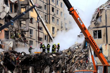 Russian missile strike destroyed residential building, Dnipro, Ukraine. Rescuers are looking for people under rubble of house, rescue equipment, fire. Russian war in Ukraine, Dnepr 2022-01-15