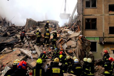Russian missile strike destroyed residential building, Dnipro, Ukraine. Rescuers are looking for people under rubble of house, fire. Russian war in Ukraine, Dnepr 2022-01-15