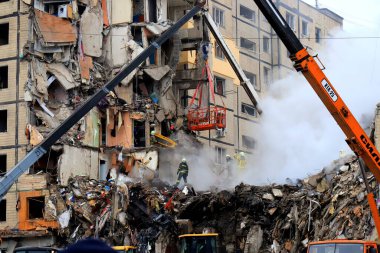 Russian missile strike destroyed residential building, Dnipro, Ukraine. Rescuers are looking for people under rubble of house, rescue equipment, fire. Russian war in Ukraine, Dnepr 2022-01-15