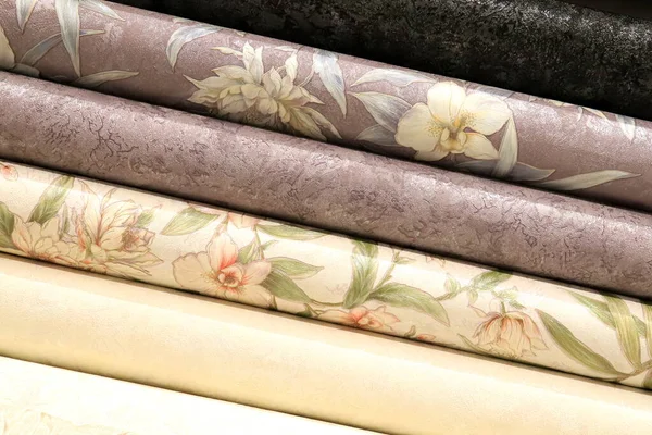 Colorful rolls of wallpaper as background, Close up wall paper, vinyl and paper, Decorative materials for renovation of room, interior in shop