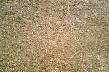 Yumuşak bej halı dokusu arkaplanı, düşük yakın görünüm