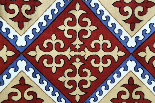 Fluffy carpet with oriental pattern, Persian, Turkish warm carpet, background texture, closeup