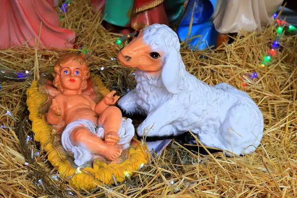 Nativity of Jesus Christ, nativity scene near the church, baby Jesus. Christmas and New Year decorations