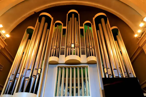 stock image Large musical organ with organ pipes in a Christian church. Musical instrument, Church service, concert