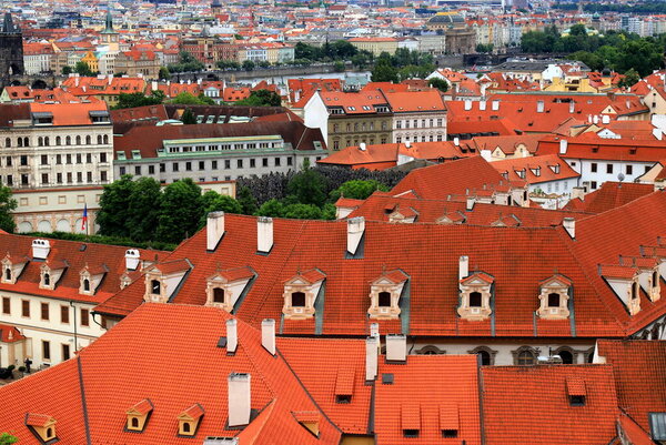 Old medieval houses, building, red tiled roofs in Prague, Czech Republic. Top view, panorama. Historical buildings in Prague Czechia