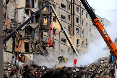 Russian missile strike destroyed residential building, Ukraine. Rescuers are looking for people under rubble of house, rescue equipment, fire. Russian war in Ukraine, Dnipro 2022-01-15