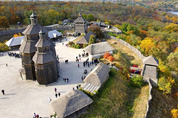 Ukraine Zaporizhzhia Cossacks. Old wooden vintage church and fortress stand on Khortytsya island, in Ukrainian city Zaporozhye. Defender Day, Drone view.