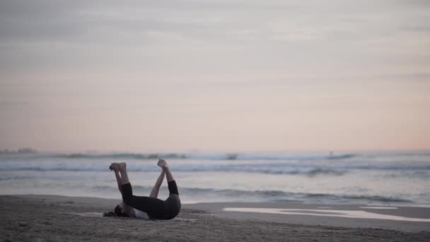 Brunette Girl Doing Yoga Posture Spreading Her Legs Seashore Spiritual — Stock Video