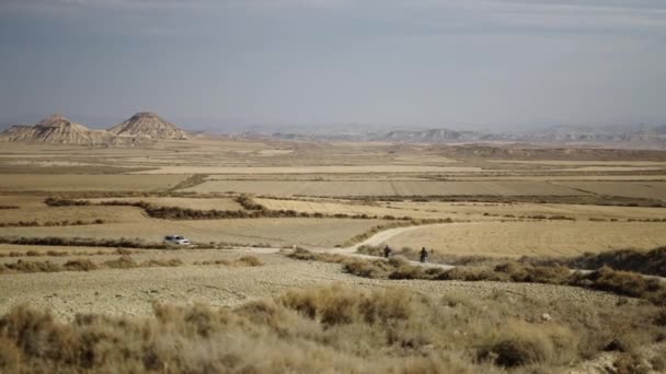 Two Motorbikes Crossing Road Desert Meet Car Spain Spanish Landscapes — Stock Video