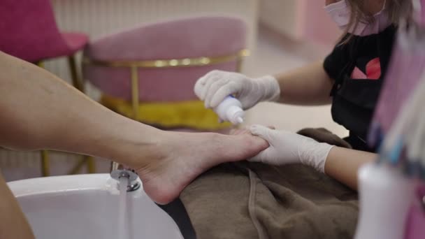 Pedicure Expert Pouring Liquid Client Nails New Treatment Health Concept — Video Stock