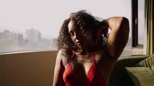 Gorgeous Latina Touching Her Curly Hair Window Body Positive — Stock Video