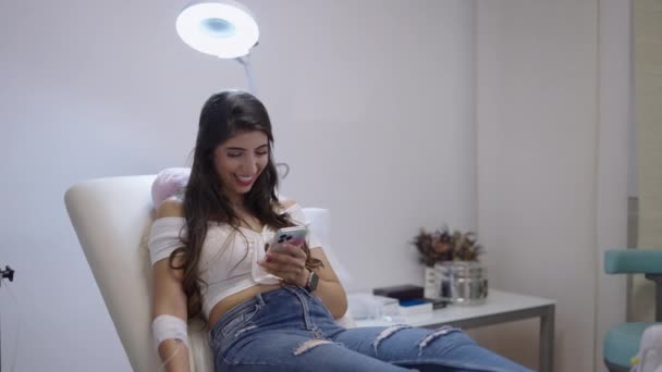 Beautiful Patient Looks Her Phone Her Arm Bandaged Intravenous Line — Stock Video