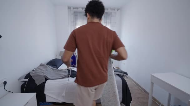 South American Boy Preparing Clothes Ironing Board Horizontal Video — Stock Video