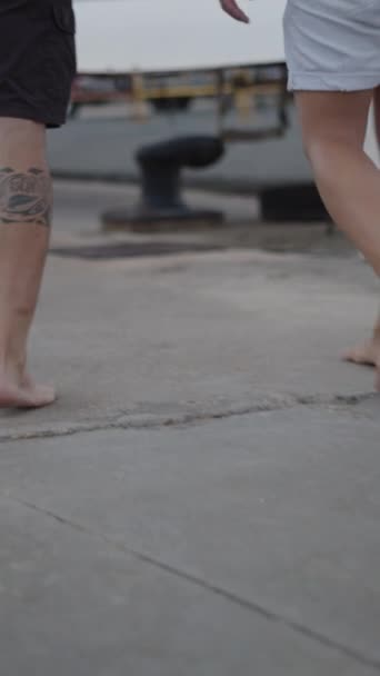 Two Men Walk Barefoot Walkway Harbour Vertical Fhd Luxury Lifestyle — Stock Video
