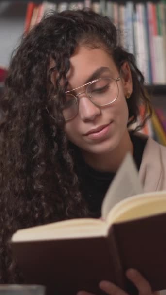 Moroccan Young Woman Smiling Enjoys Reading Book Her Free Time — Stock Video