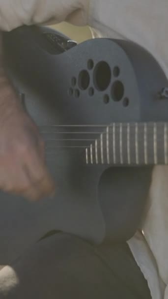 Mans Hands Playing Black Acoustic Ovation Guitar Outdoors Sunset Крупный — стоковое видео
