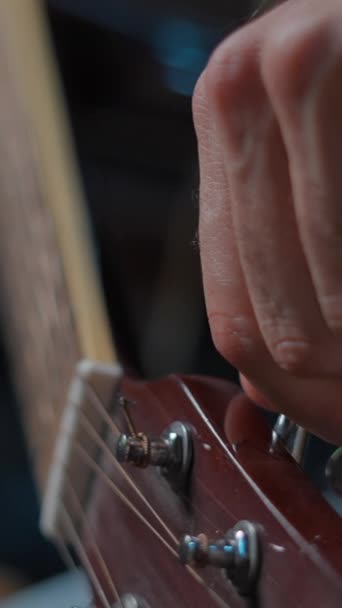 Hairy Mans Hand Tuning Guitar Adjusting Its Peg Slow Motion — Wideo stockowe