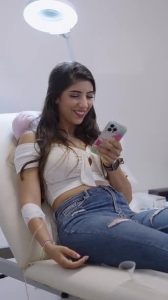 Beautiful Woman Sitting Clinic Table Having Fun Phone Fhd Vertical — Stock Video