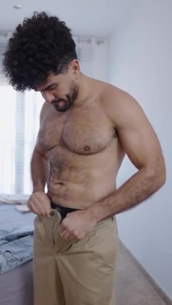 Man Undoes Button His Trousers Walks His Wardrobe Fhd Vertical — Stock Video