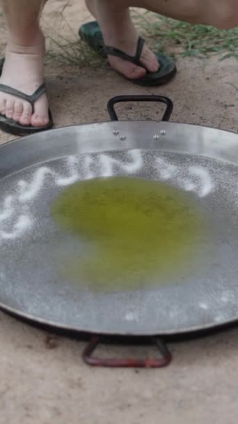 Unrecognizable Man Puts Salt Paella Next Oil Spanish Traditional Food — Stock Video